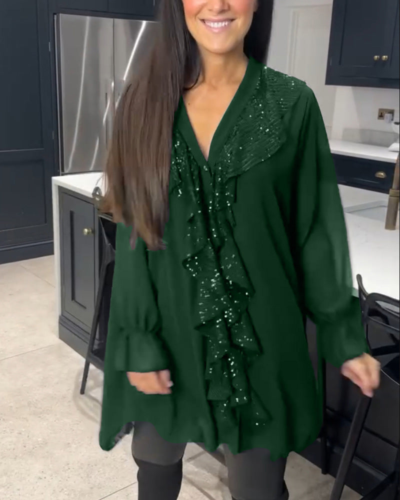 Blus med volanger och elegant stil