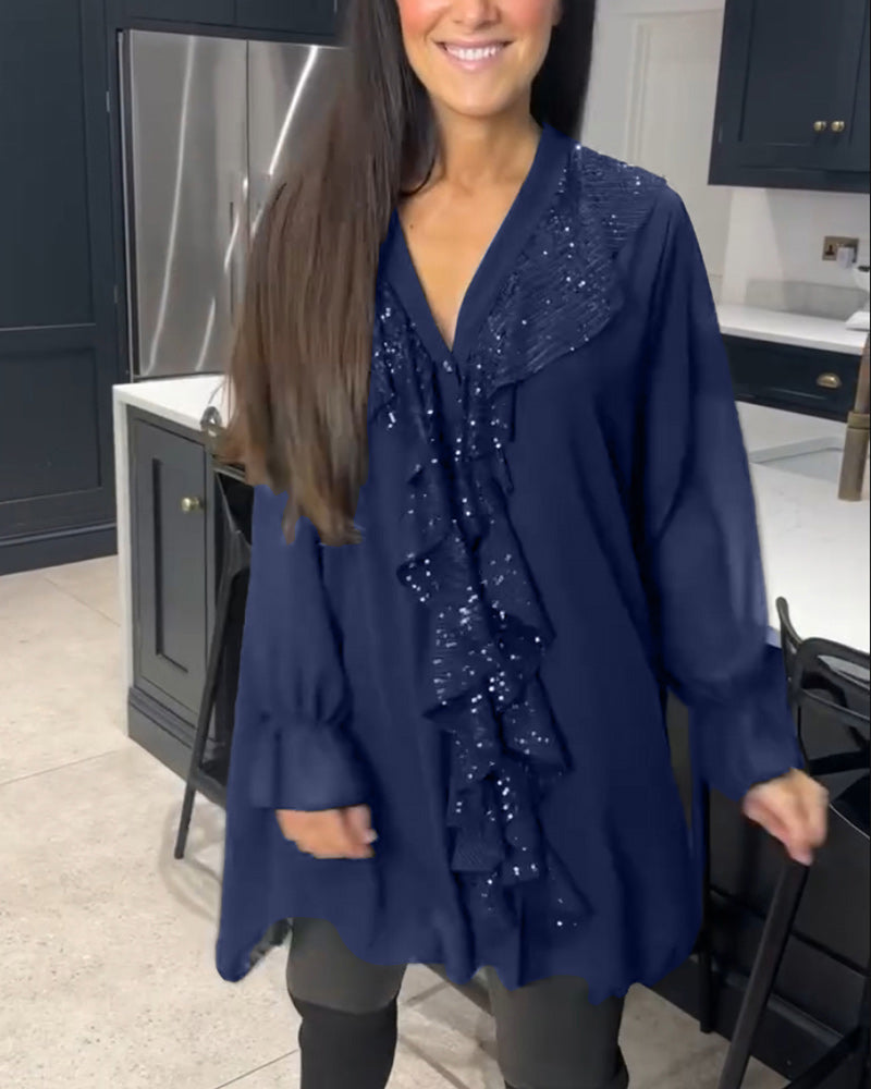 Blus med volanger och elegant stil