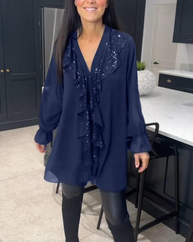 Blus med volanger och elegant stil