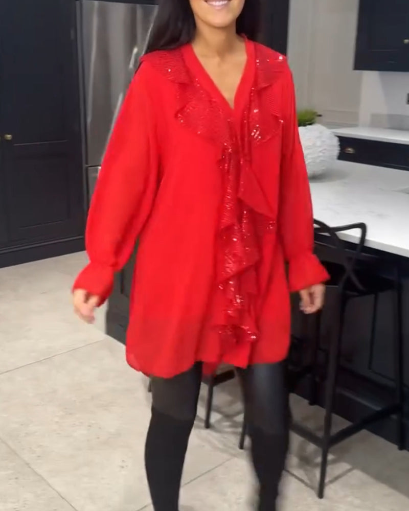 Blus med volanger och elegant stil