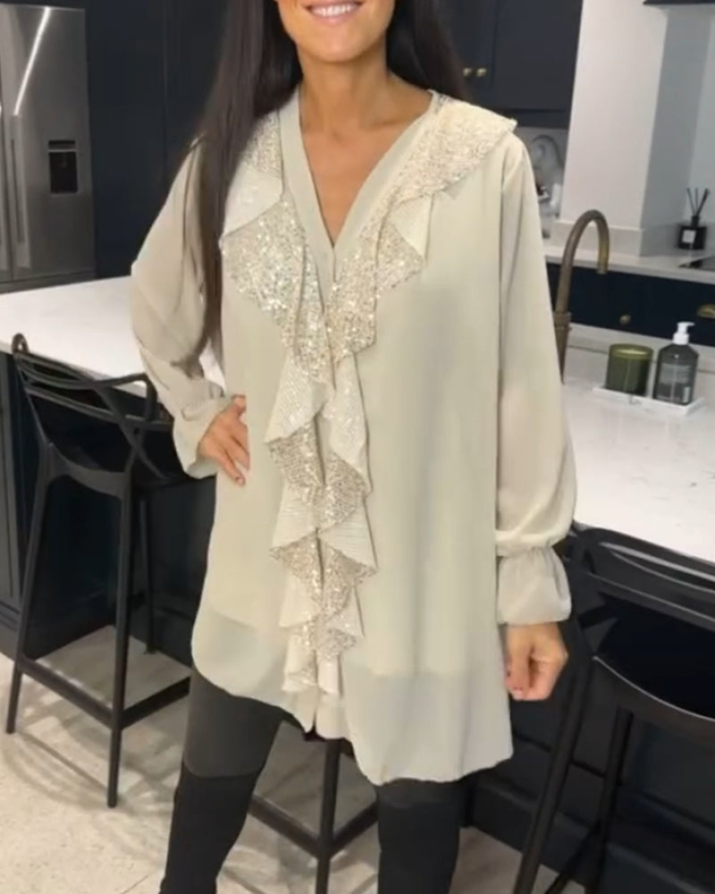 Blus med volanger och elegant stil