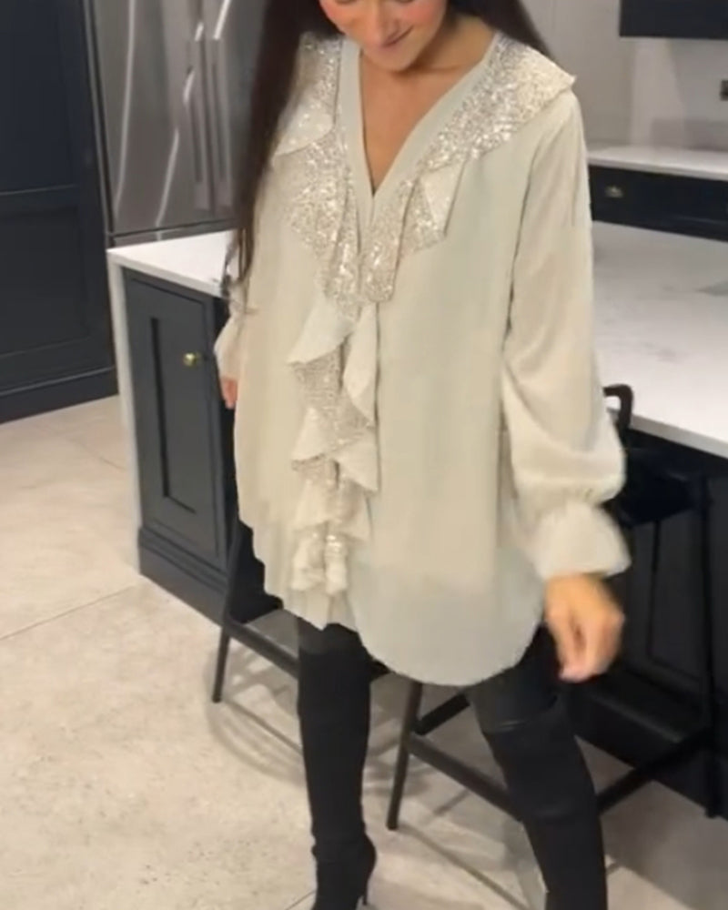 Blus med volanger och elegant stil
