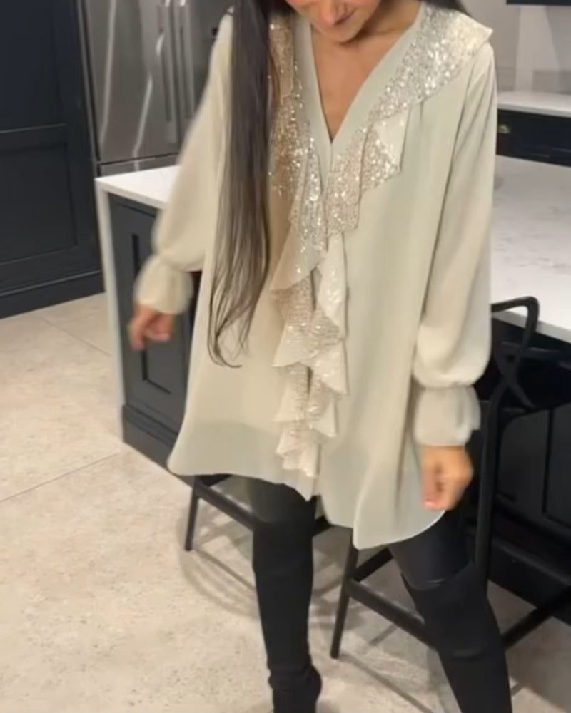 Blus med volanger och elegant stil