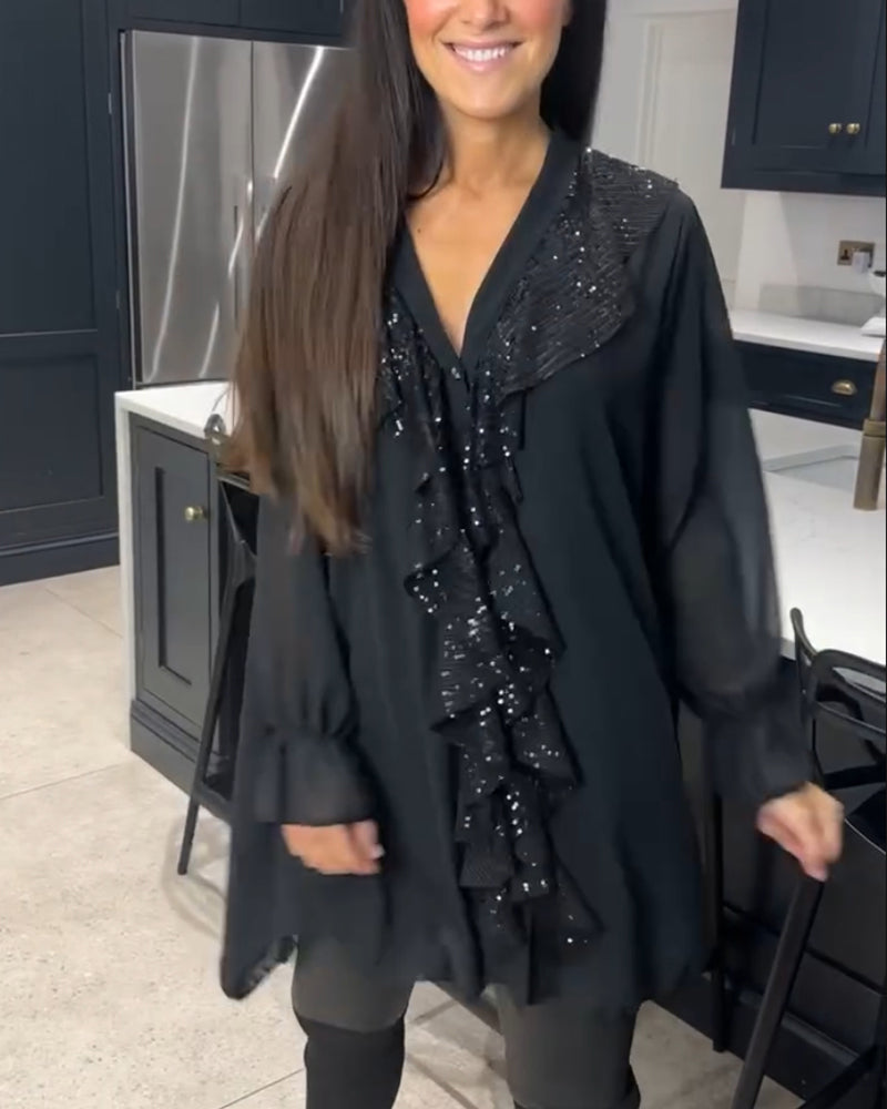 Blus med volanger och elegant stil