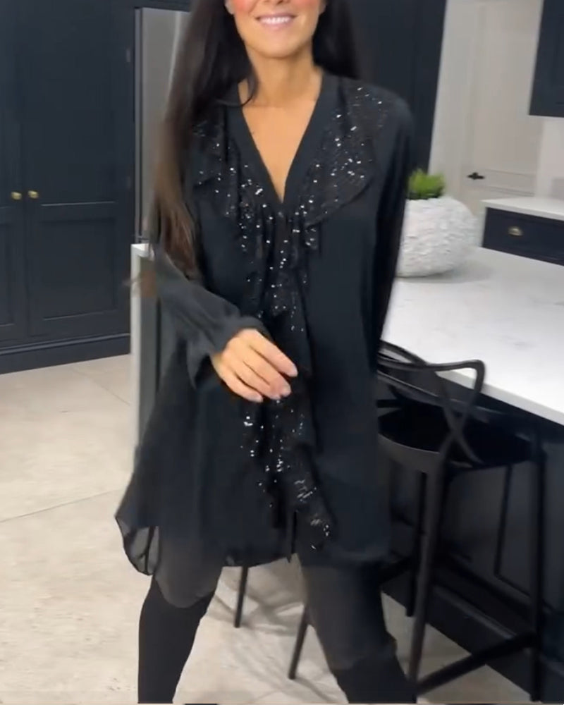 Blus med volanger och elegant stil