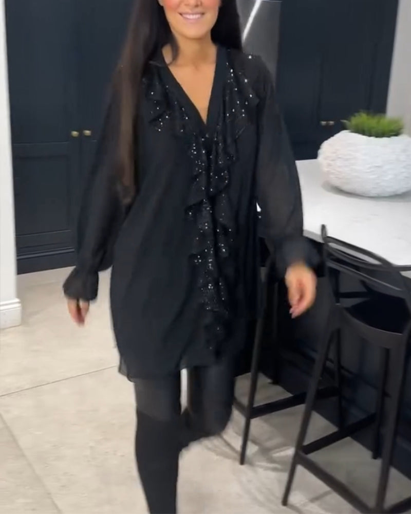 Blus med volanger och elegant stil