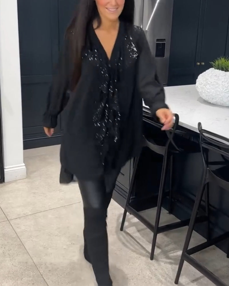 Blus med volanger och elegant stil