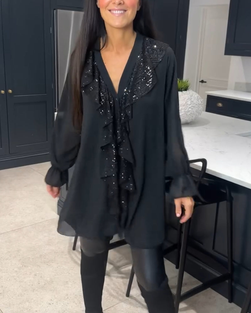 Blus med volanger och elegant stil